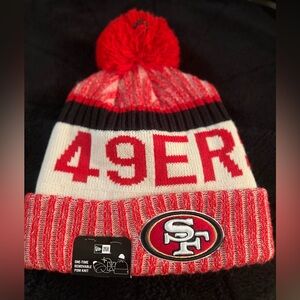 Men's San Francisco 49ers New Era Scarlet 2024 Sideline Cuffed Knit Hat with Pom